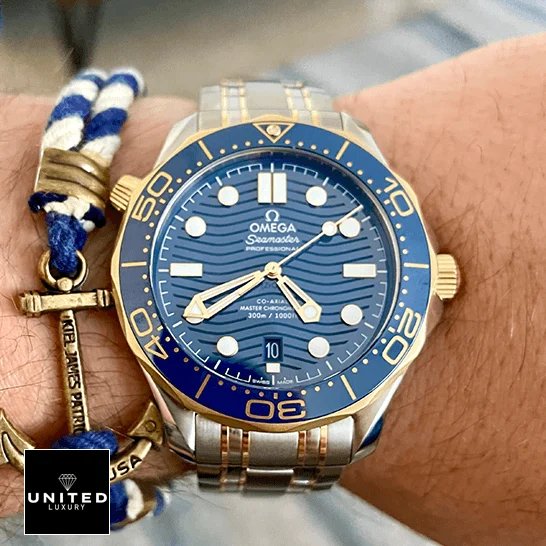 Omega Seamaster Diver Master Co-Axial 210.20.42.20.03.001 Exceptional Replica 1:1 omega seamaster diver 300m 210.20.42.20.03.001 replica wrist Omega Seamaster Diver 300m Gold Blue Dial Replica on the man wrist