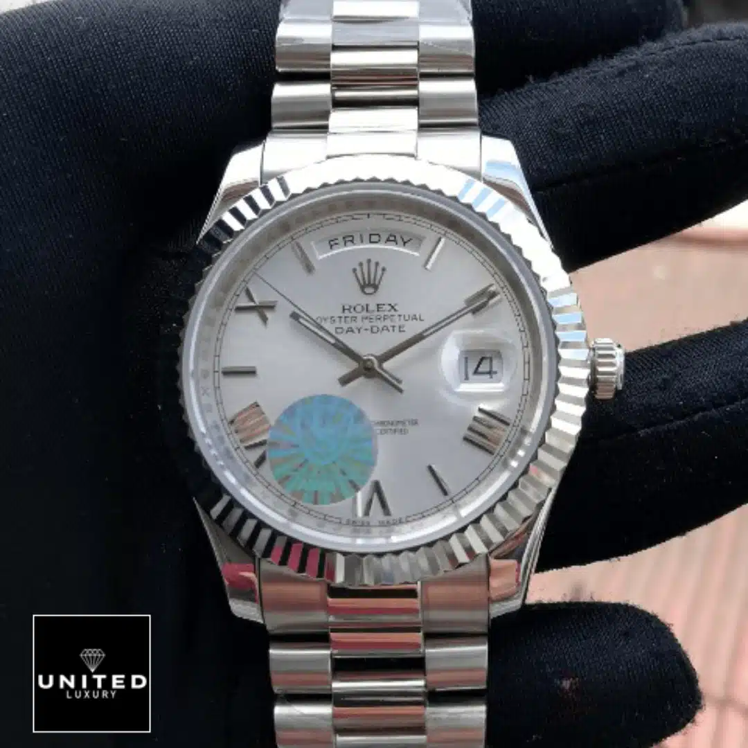 Rolex Day-Date 228239 Day-Date 228239 Roman Fluted Bezel White Dial Replica on the hand