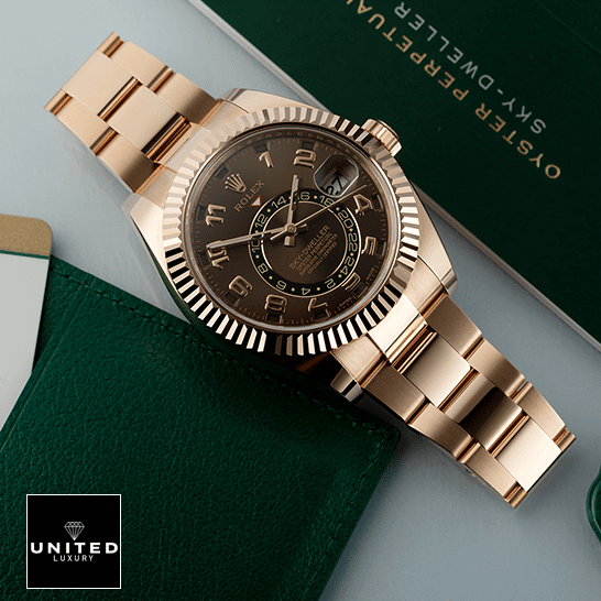 Rolex Sky-Dweller 326935 Rolex Sky-Dweller Chocolate Dial Rose Gold 326935-0003 Oyster Replica on the table