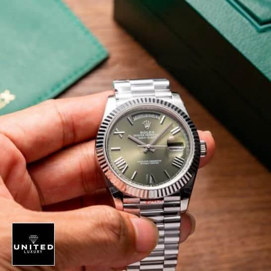 Rolex Day-Date 228239-0033 Rolex Day-date green dial roman replica on the hand with