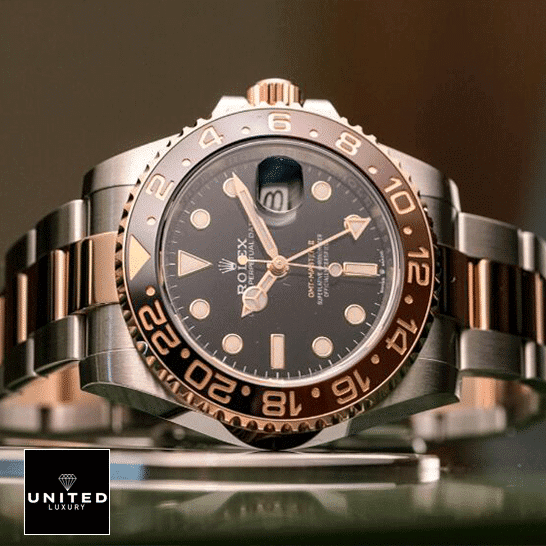 Rolex GMT-Master II 126711CHNR Rolex GMT-Master II Black Dial Ceramic Indices 126711CHNR-0002 Replica on the table