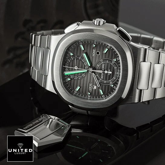 Patek Philippe Nautilus Travel Time Chronograph 5990/1A-001 First-Class Clone patek philippe nautilus 59901A 001 replica tiltedleft Patek Philippe Geneve Black Dial Steel Case Replica dial phosphor