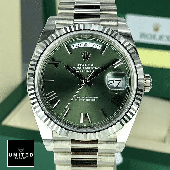 Rolex Day-Date 228239-0033 Rolex Day-Date Olive Green 228239 Replica Rolex Box in front of