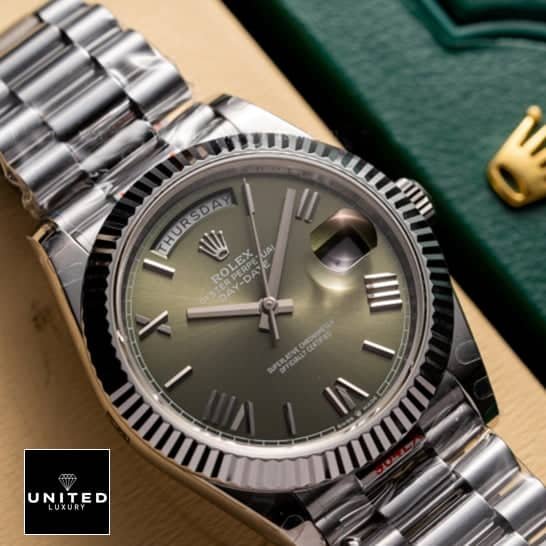 Rolex Day-Date 228239-0033 Rolex Day-date 228239-0033 Olive green dial replica above the rolex box