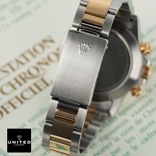 Rolex Daytona Cosmograph 16523 Rolex Daytona S.Steel Two Tone Bracelet Fold Clasp 16523 Replica on the table