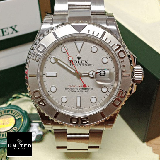 Rolex Yacht-Master 126621 Rolex Yacht Master Platinum Dial Steel Replica next to warranty card