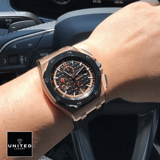 Audemars Piguet Royal Oak Offshore 26208ST.OO.D305CR.01 Audemars Piguet Black Bezel Replica on the steering wheel on a man's wrist