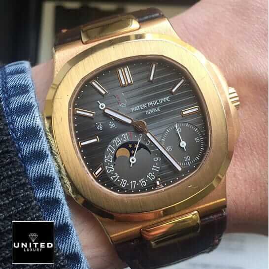 Patek Philippe Nautilus 5712R-001 Patek Philippe Nautilus Black Dial Rose Gold Replica on the man wrist