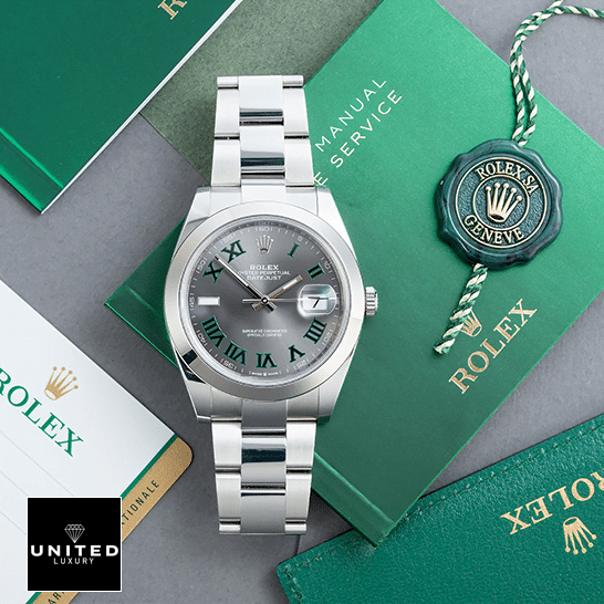 Rolex Datejust 126333 Rolex Datejust Wimbledon 126300-0013 Oyster Replica & Guarantee Card on the table