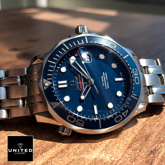 Omega Seamaster Diver Co-Axial Master Chronometer 212.30.41.20.03.001 High-End Replica 1:1 Omega Seamaster 300m Axial Steel Replica on the wooden table